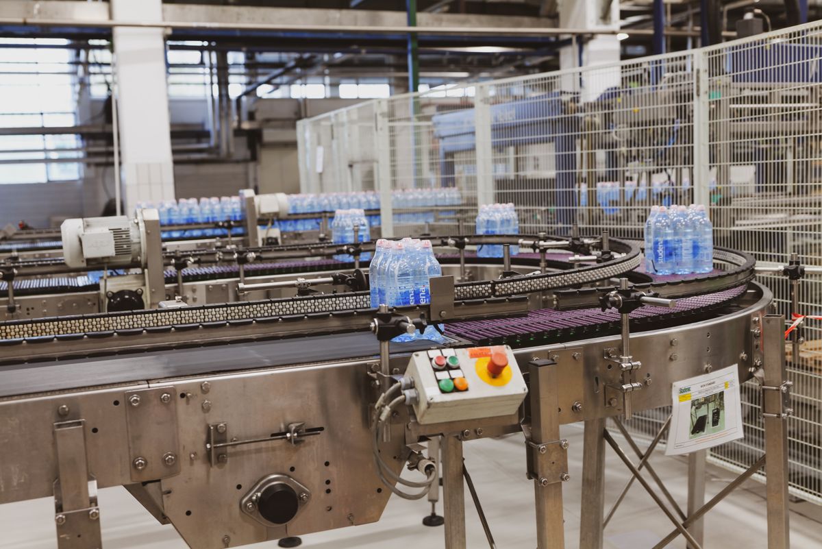 Production line workers in a manufacturing facility
